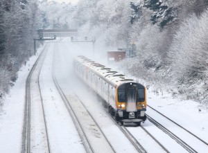 commuter train travelling in snow